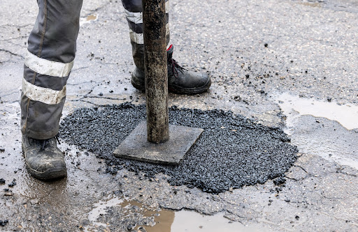 repairing pothole | pothole repair