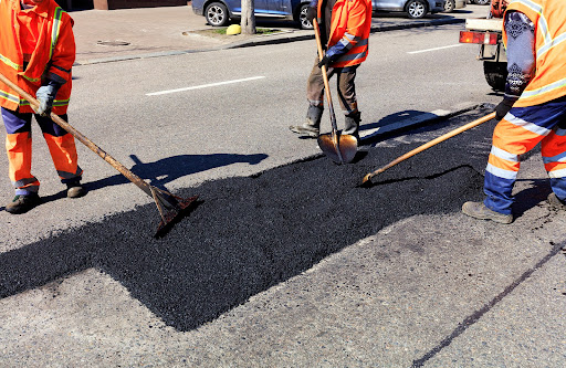 men fixing road | utility cut repair