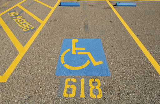 wheel chair traffic sign 618 | ADA compliance on pavement