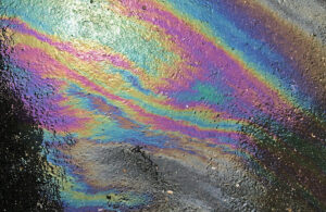 rainbow colored oil | oil spots on asphalt