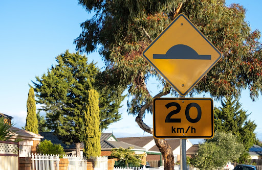 20 kilometers per hour sign | community speed bumps